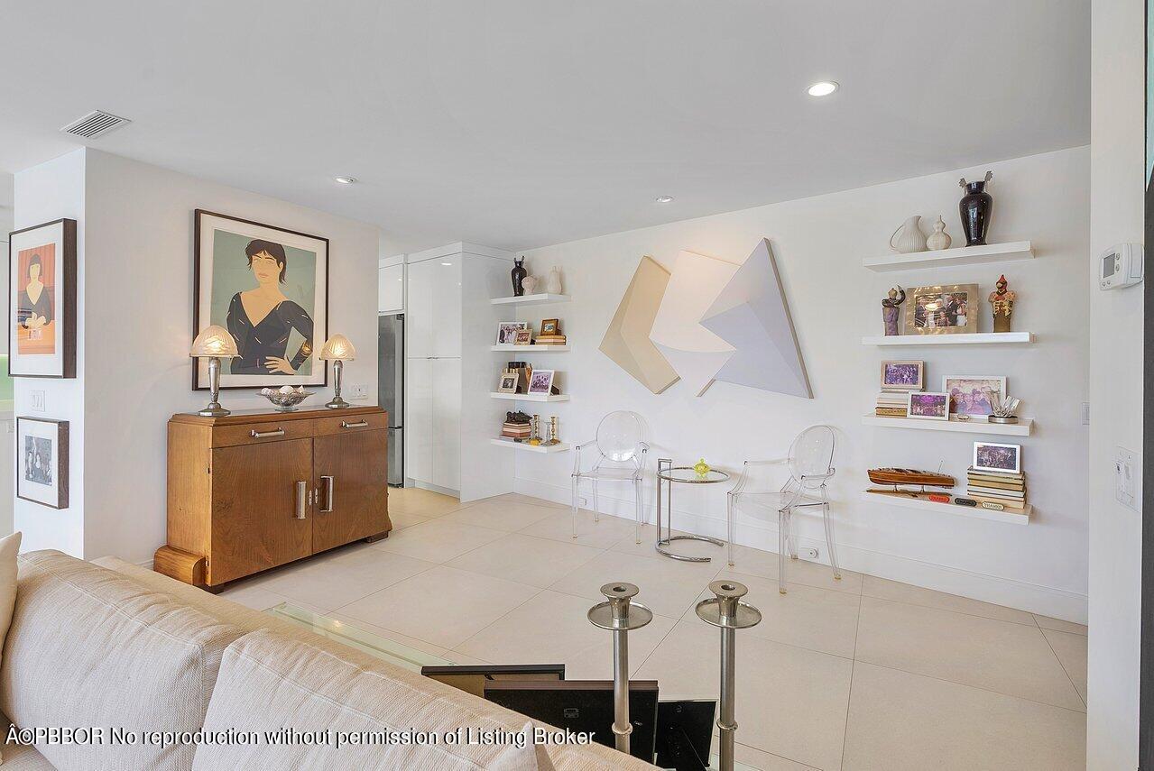 44 Cocoanut Row, Unit 122B Palm Beach, FL 33480 - Photo 10 of 21 a living room with furniture and a wooden floor