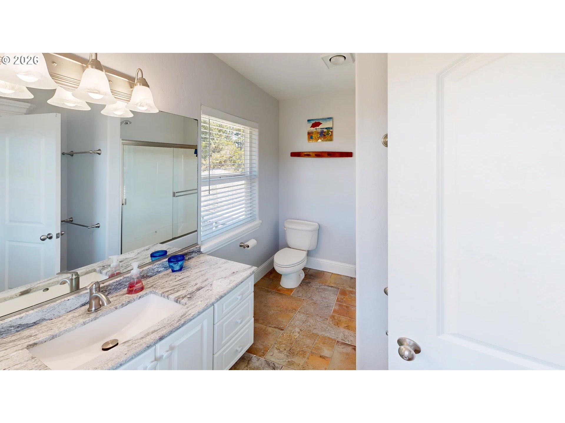 842 Chetco Point Terrace Brookings, OR 97415 - Photo 25 of 33 a bathroom with a sink mirror and toilet