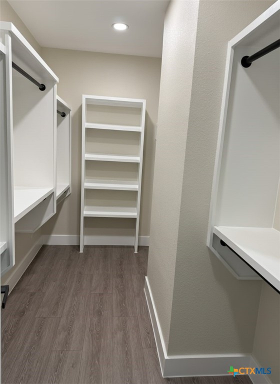 205 Haller Street Yoakum, TX 77995 - Photo 7 of 12 a view of walk in closet with empty racks