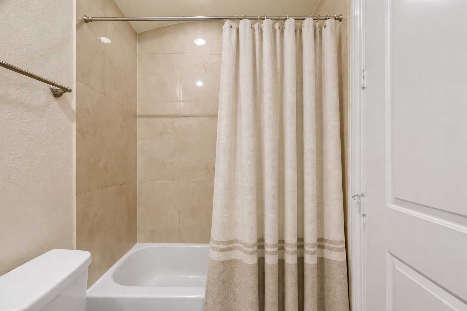 705 Delano Street Houston, TX 77003 - Photo 16 of 47 a bathroom with a shower and a bath tub