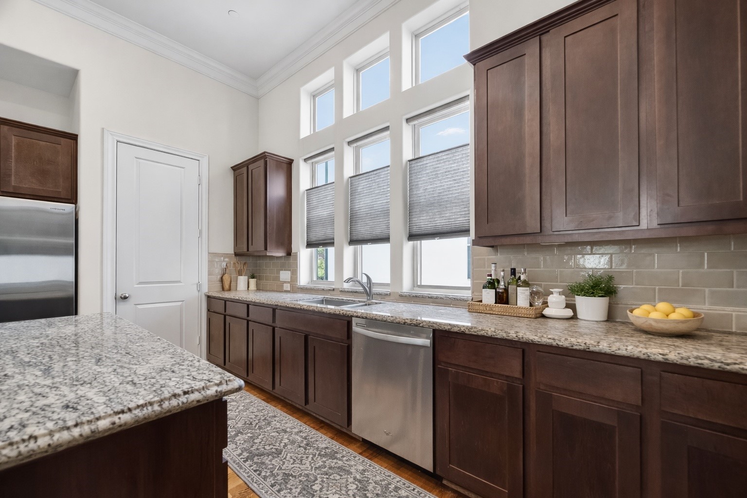 705 Delano Street Houston, TX 77003 - Photo 18 of 47 a kitchen with stainless steel appliances granite countertop a sink stove and cabinets