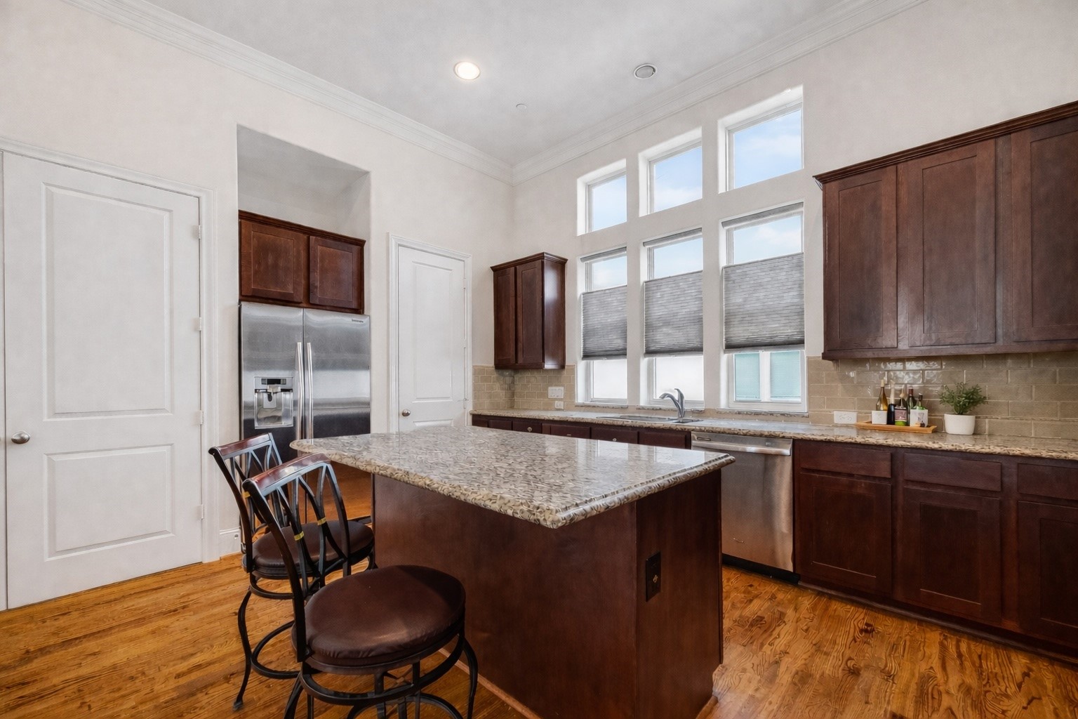 705 Delano Street Houston, TX 77003 - Photo 19 of 47 a table and chairs in a kitchen