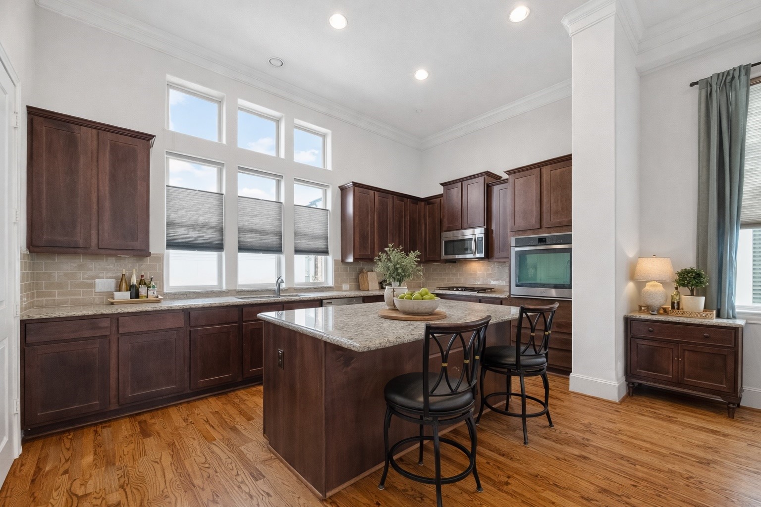 705 Delano Street Houston, TX 77003 - Photo 20 of 47 a kitchen with stainless steel appliances granite countertop wooden cabinets a stove top oven a sink and dishwasher