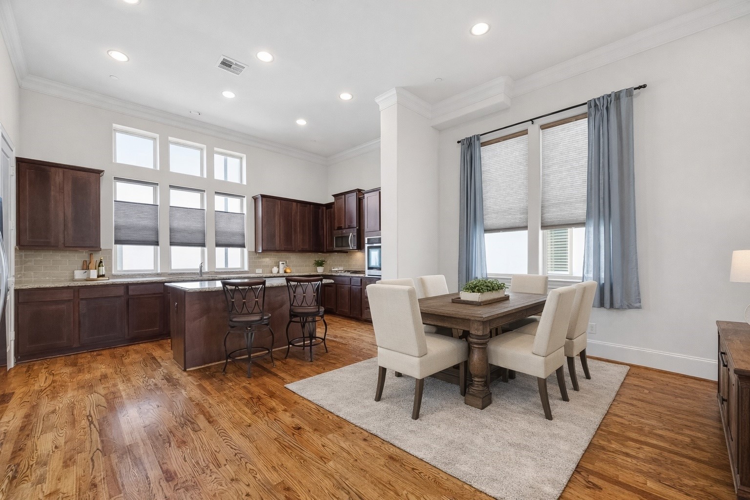 705 Delano Street Houston, TX 77003 - Photo 21 of 47 a view of a dining room with furniture window and wooden floor