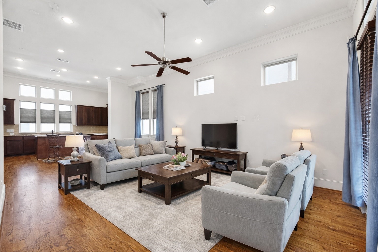 705 Delano Street Houston, TX 77003 - Photo 24 of 47 a living room with furniture flat screen tv and wooden floor