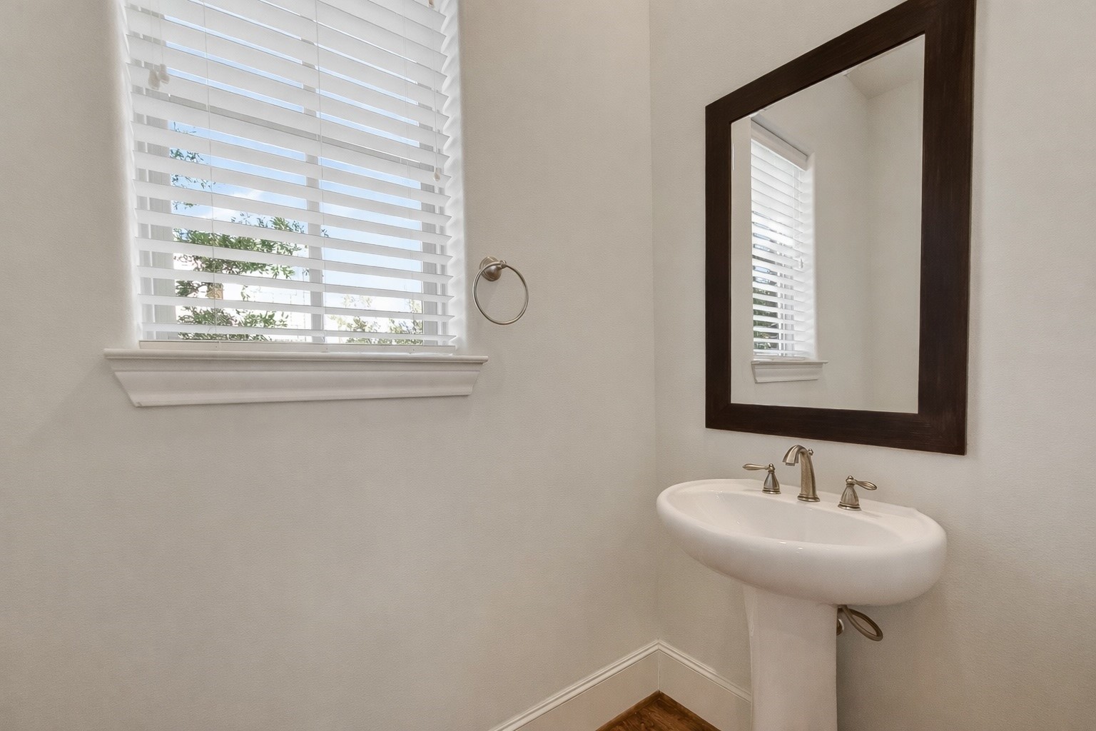 705 Delano Street Houston, TX 77003 - Photo 25 of 47 a bathroom with a sink and a mirror