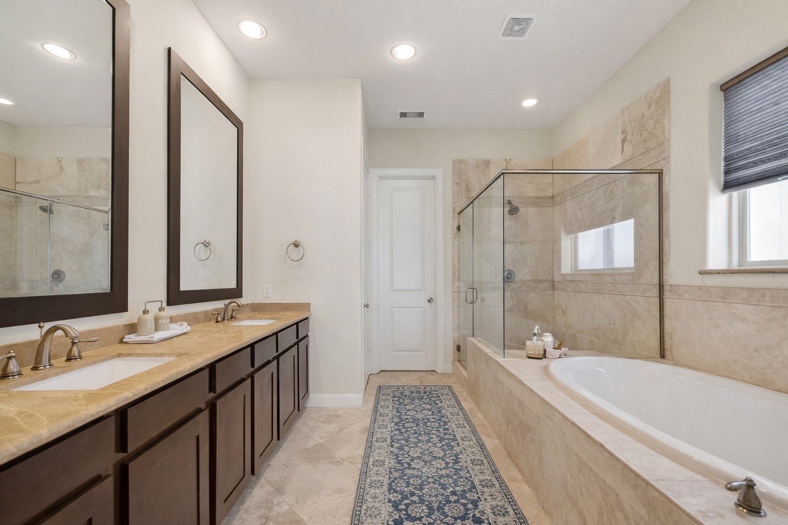 705 Delano Street Houston, TX 77003 - Photo 29 of 47 a bathroom with a granite countertop tub sink shower and mirror