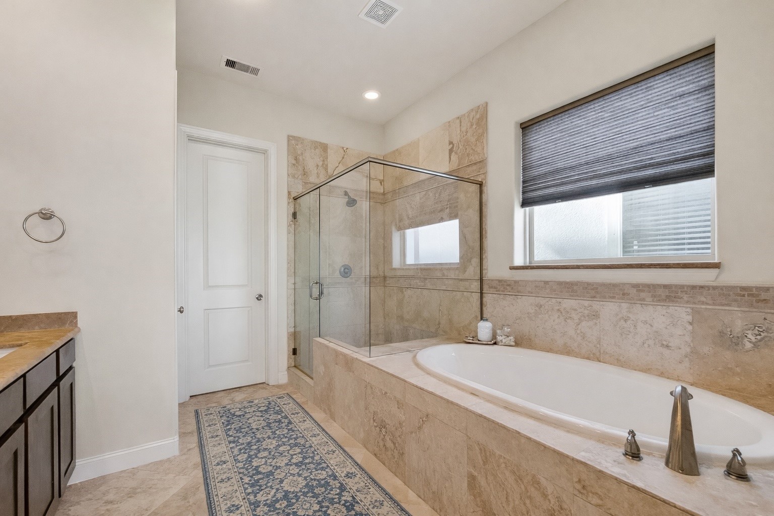 705 Delano Street Houston, TX 77003 - Photo 30 of 47 a bathroom with a tub sink and mirror