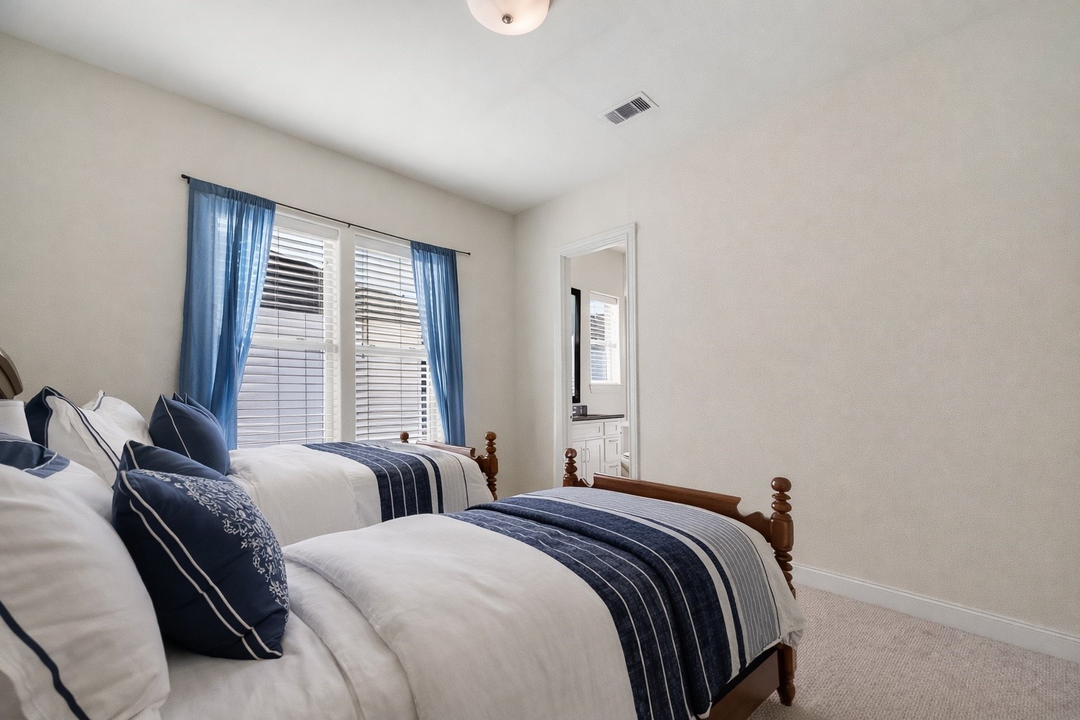 705 Delano Street Houston, TX 77003 - Photo 33 of 47 a bedroom with two beds and a large window