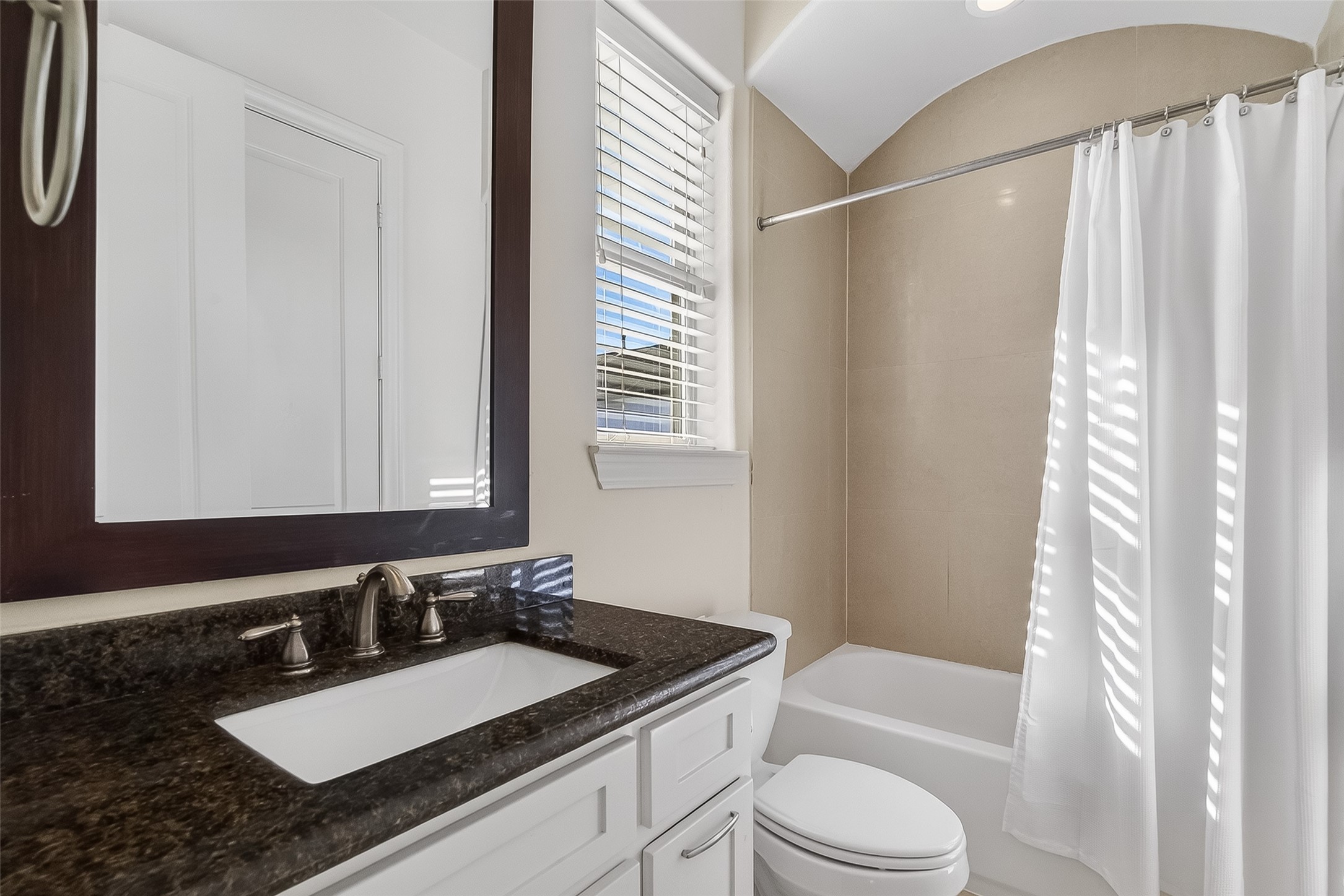 705 Delano Street Houston, TX 77003 - Photo 34 of 47 a bathroom with a sink a toilet a mirror and shower