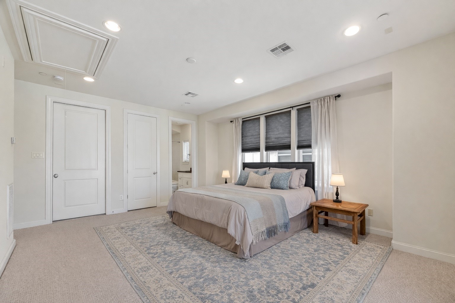 705 Delano Street Houston, TX 77003 - Photo 36 of 47 a spacious bedroom with a bed and a table