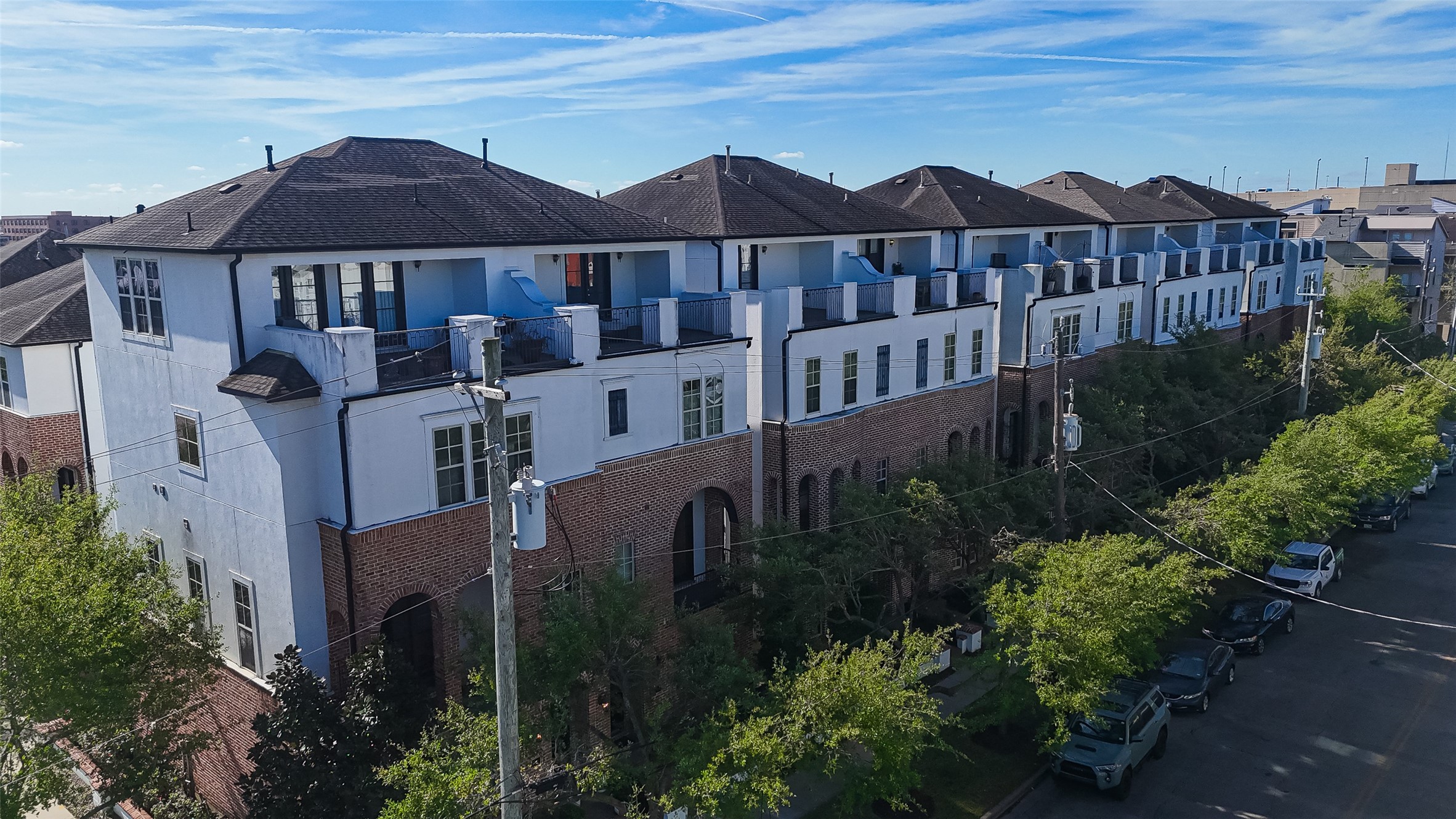 705 Delano Street Houston, TX 77003 - Photo 42 of 47 a view of a big house with plants and wooden fence