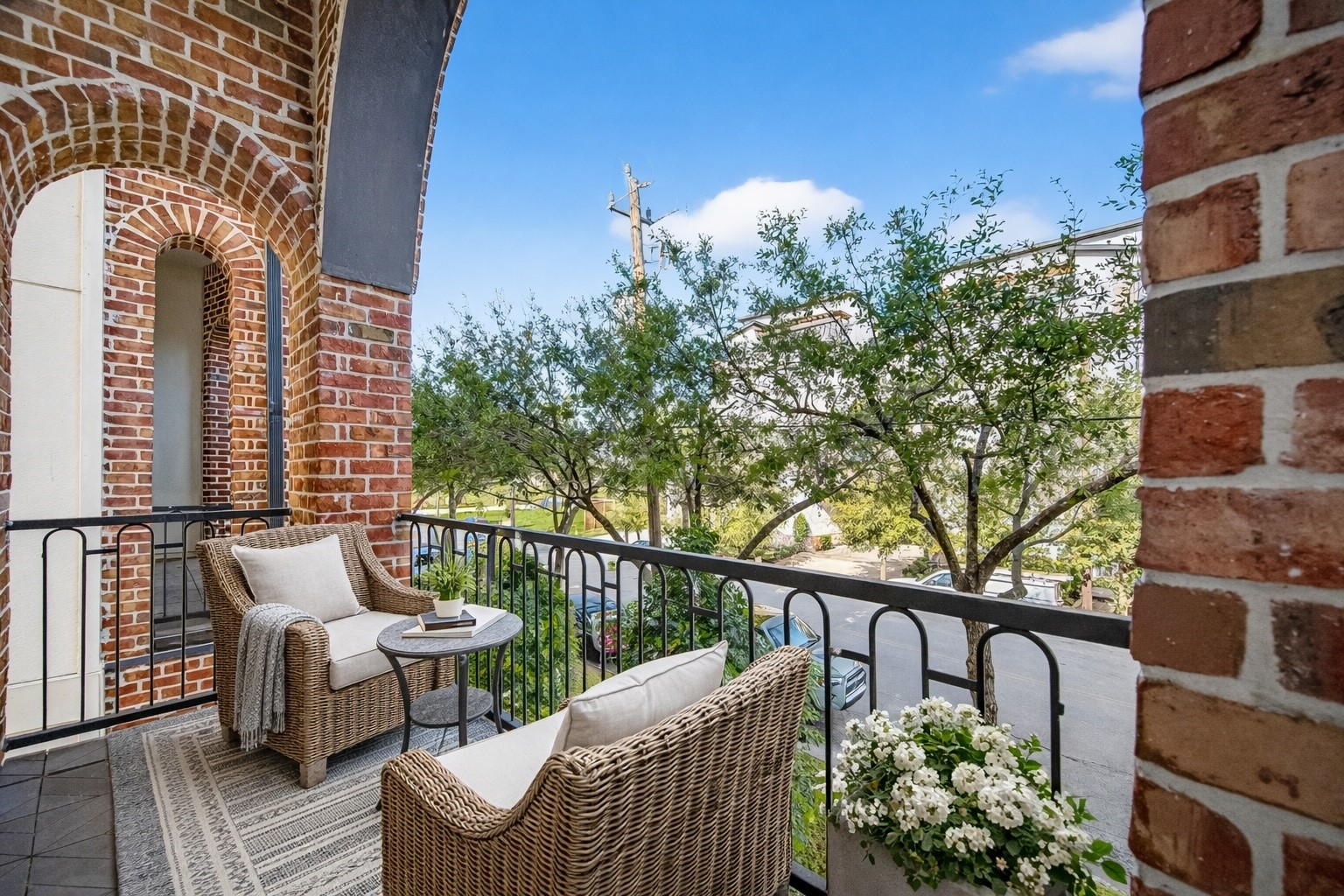705 Delano Street Houston, TX 77003 - Photo 7 of 47 a view of a balcony with couches and wooden floor