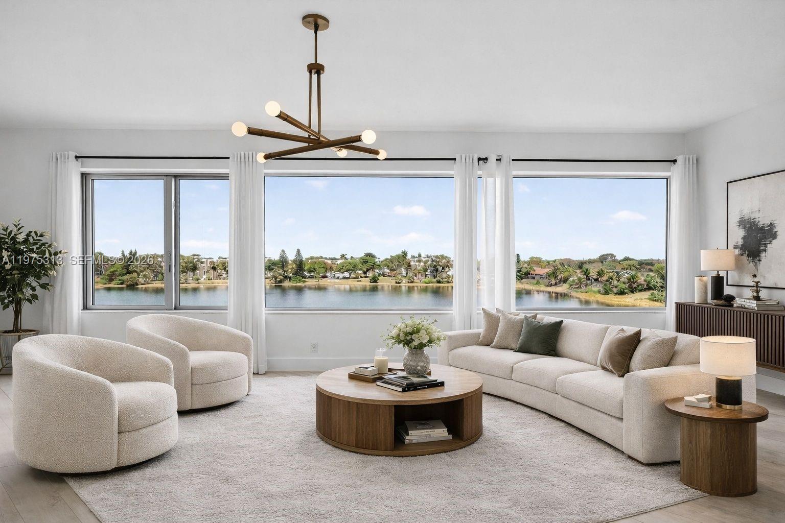 877 Northeast 195th Street, Unit 422 Miami, FL 33179 - Photo 5 of 24 Virtually staged family room/living/dining area