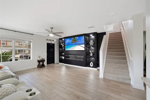 a kitchen with stainless steel appliances a refrigerator stove microwave and sink