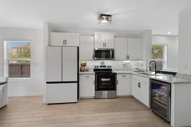 a view of a workspace with furniture and a garage