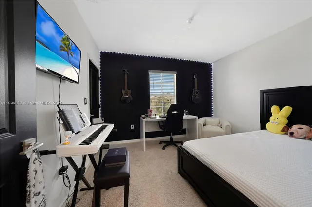 a view of walk in closet with clothes