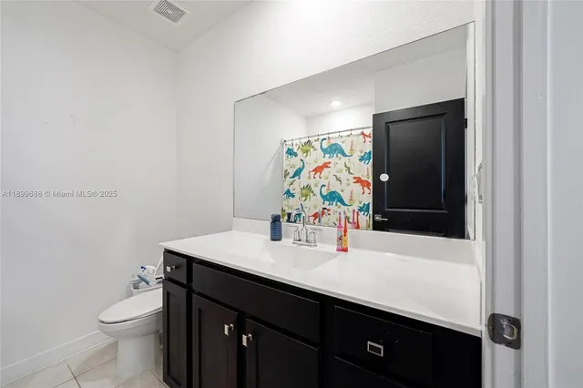 an aerial view of multiple houses with outdoor space