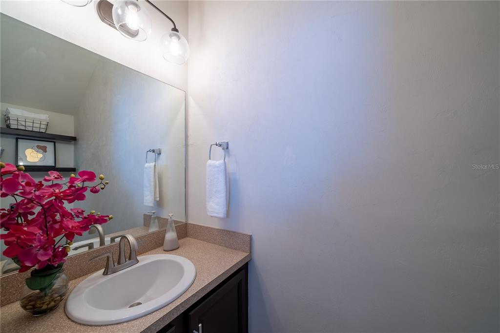 Undisclosed Address Gainesville, FL 32607 - Photo 17 of 21 a bathroom with a sink vanity mirror and toilet