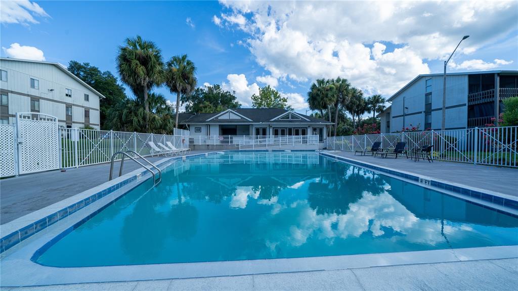Undisclosed Address Gainesville, FL 32607 - Photo 4 of 21 a view of a swimming pool with a patio