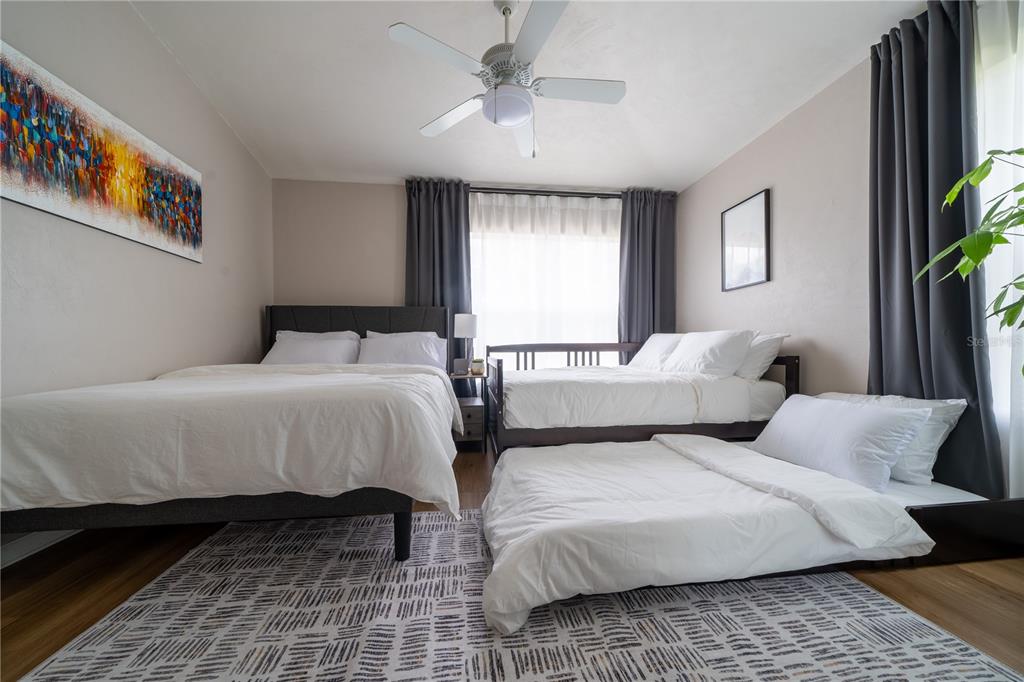 Undisclosed Address Gainesville, FL 32607 - Photo 10 of 21 a bedroom with double bed and a window