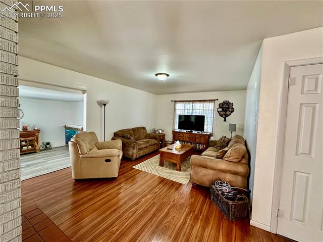 1701 Jerry Murphy Road Pueblo, CO 81001 - Photo 3 of 20 Living room with wood finished floors