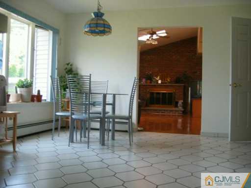 104 Roxy Avenue Edison, NJ 08820 - Photo 2 of 5 a view of game room with windows