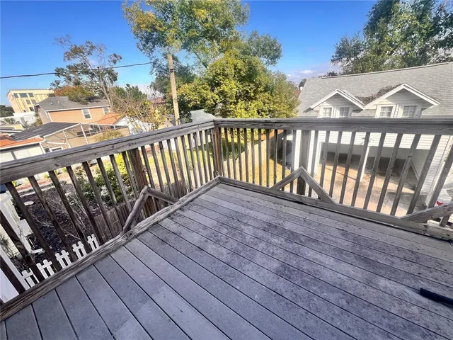 a view of a wooden street from a balcony