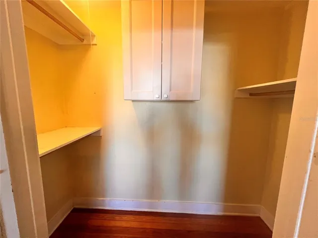 a view of a small space with wooden floor