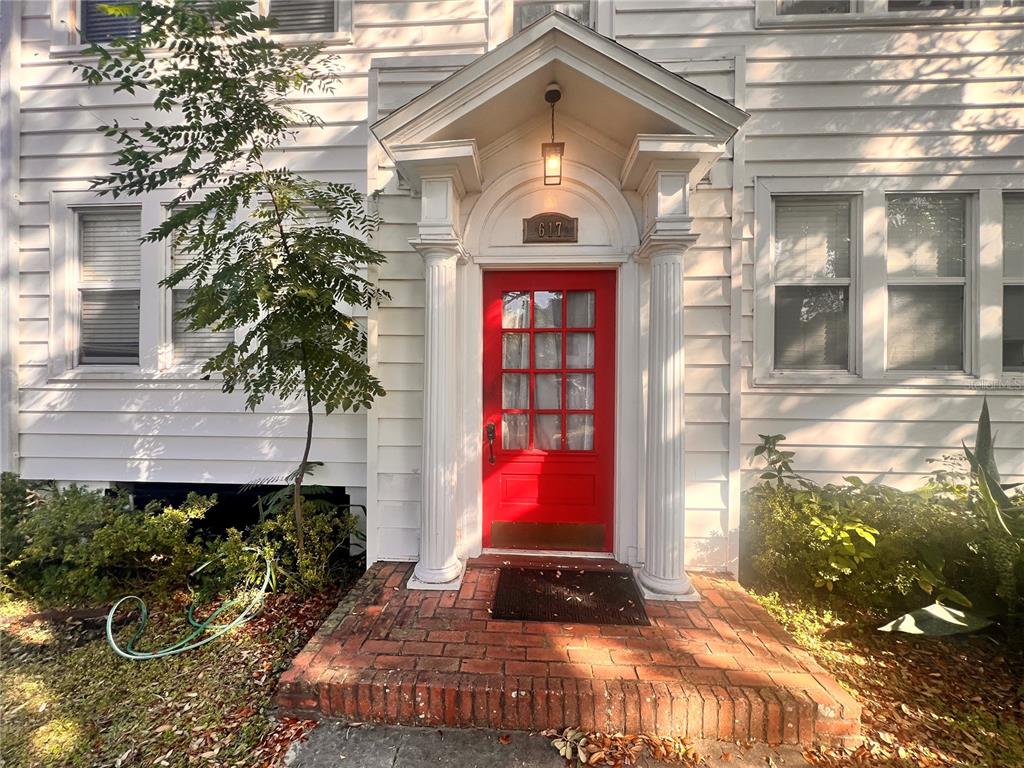 617 North Hyer Avenue, Unit 3 Orlando, FL 32803 - Photo 2 of 13 a front view of a house with a yard