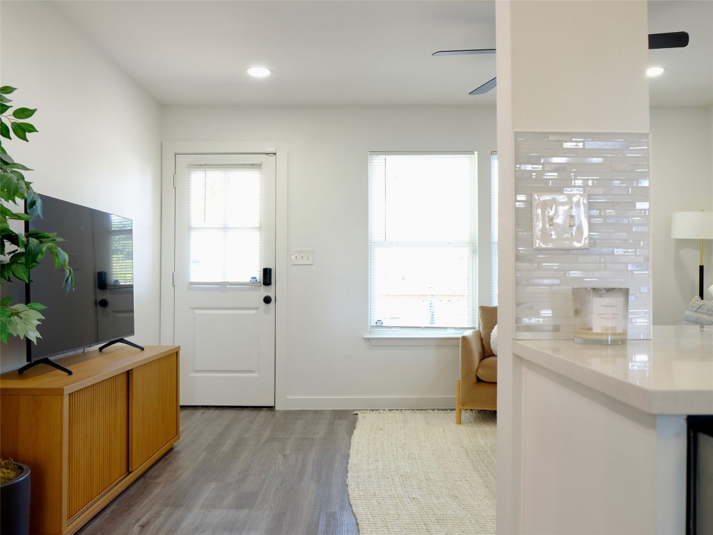 1401 Marcus Place, Unit B Austin, TX 78721 - Photo 11 of 38 a bathroom with a sink a bathtub and a window
