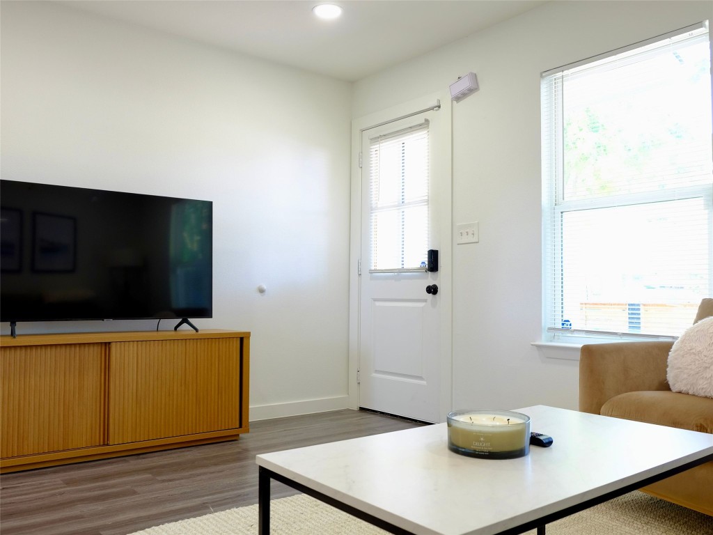 1401 Marcus Place, Unit B Austin, TX 78721 - Photo 12 of 38 a living room with furniture and a flat screen tv