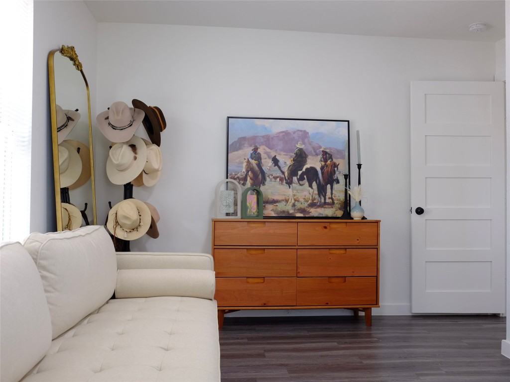 1401 Marcus Place, Unit B Austin, TX 78721 - Photo 30 of 38 a living room with furniture and wooden floor
