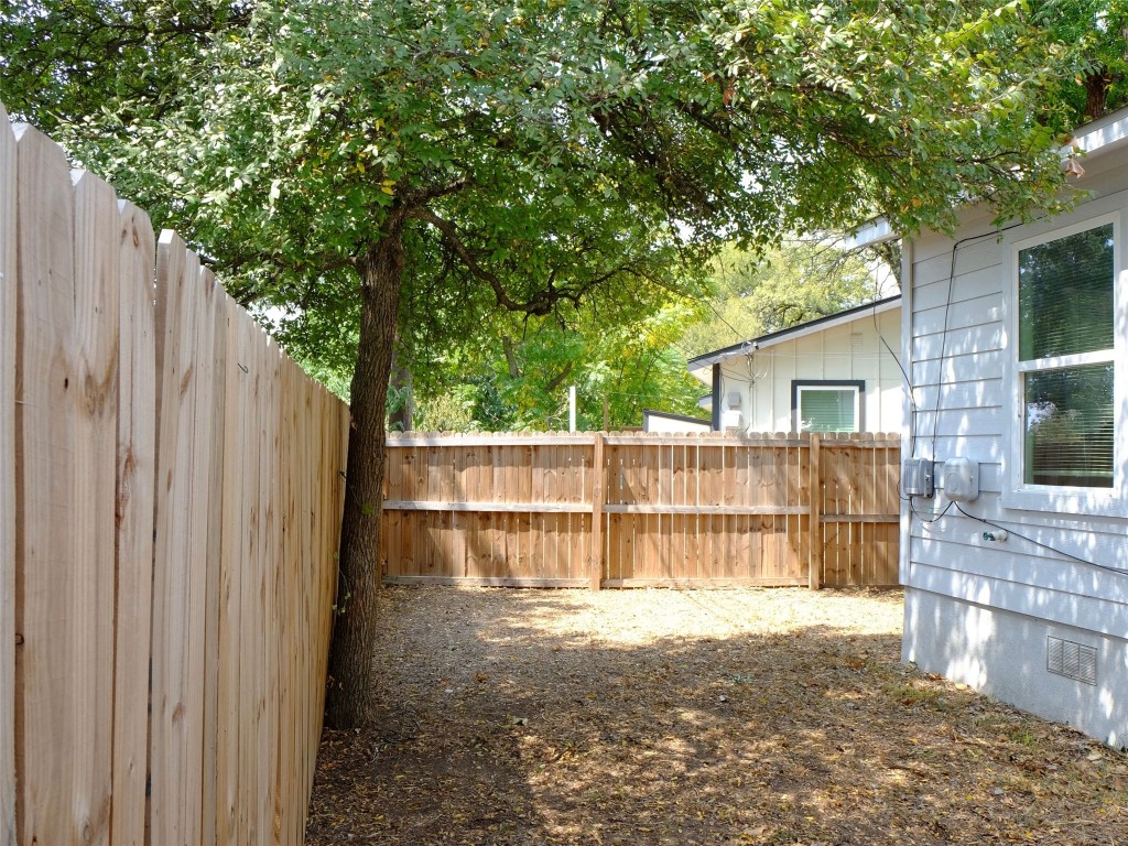 1401 Marcus Place, Unit B Austin, TX 78721 - Photo 34 of 38 a view of a house with backyard and sitting area