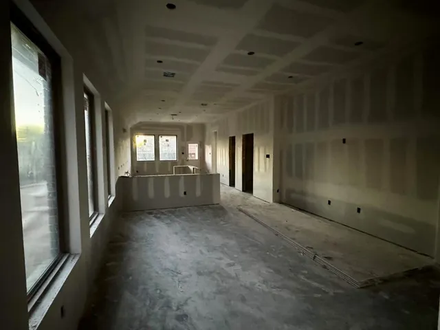 a view of a hallway with an entryway