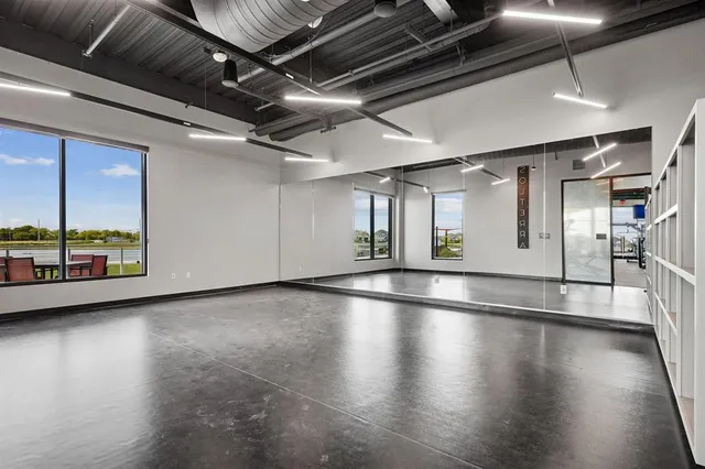 a view of water heater room with wooden floor