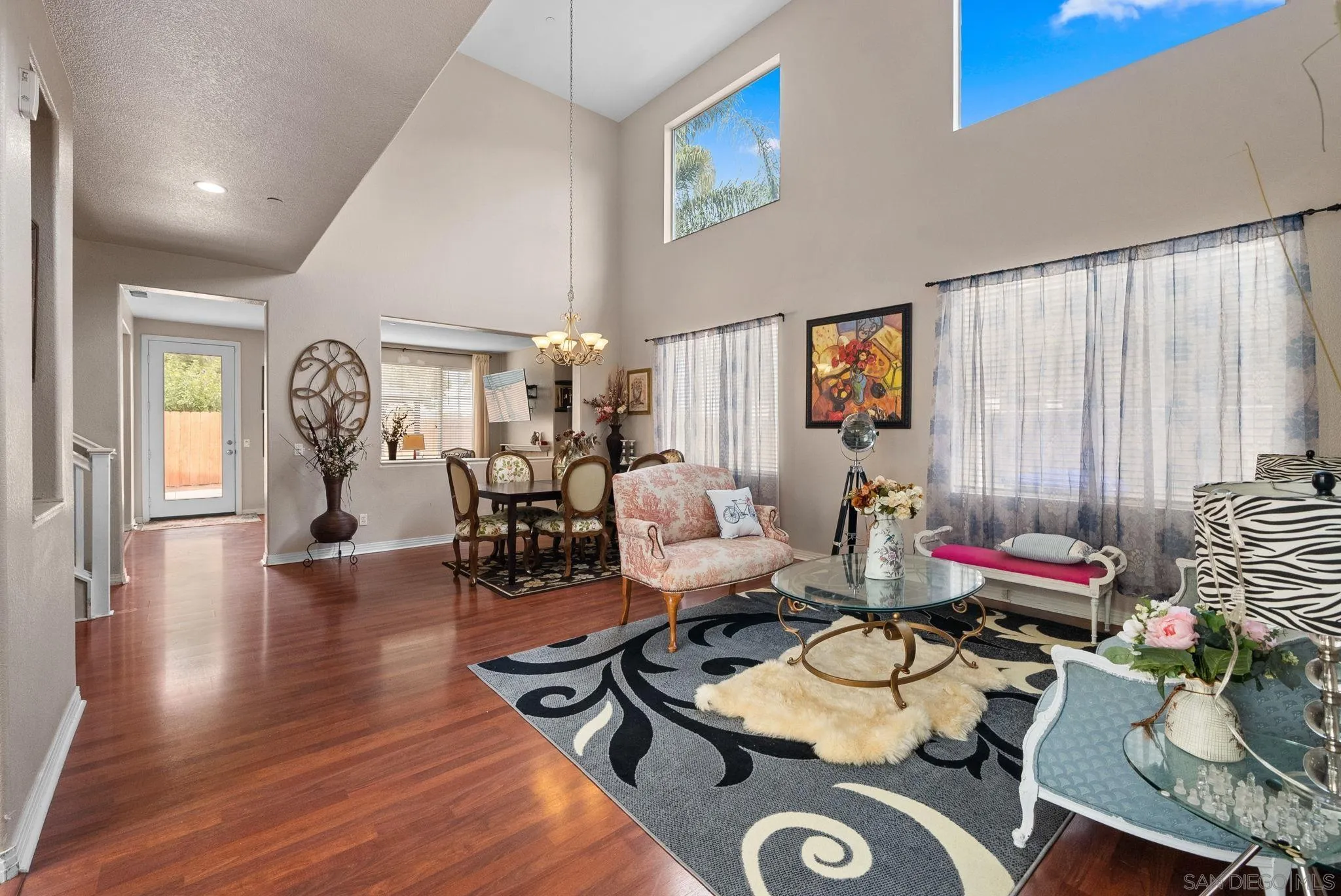 461 Poets Square Fallbrook, CA 92028 - Photo 8 of 40 a living room with furniture and wooden floor
