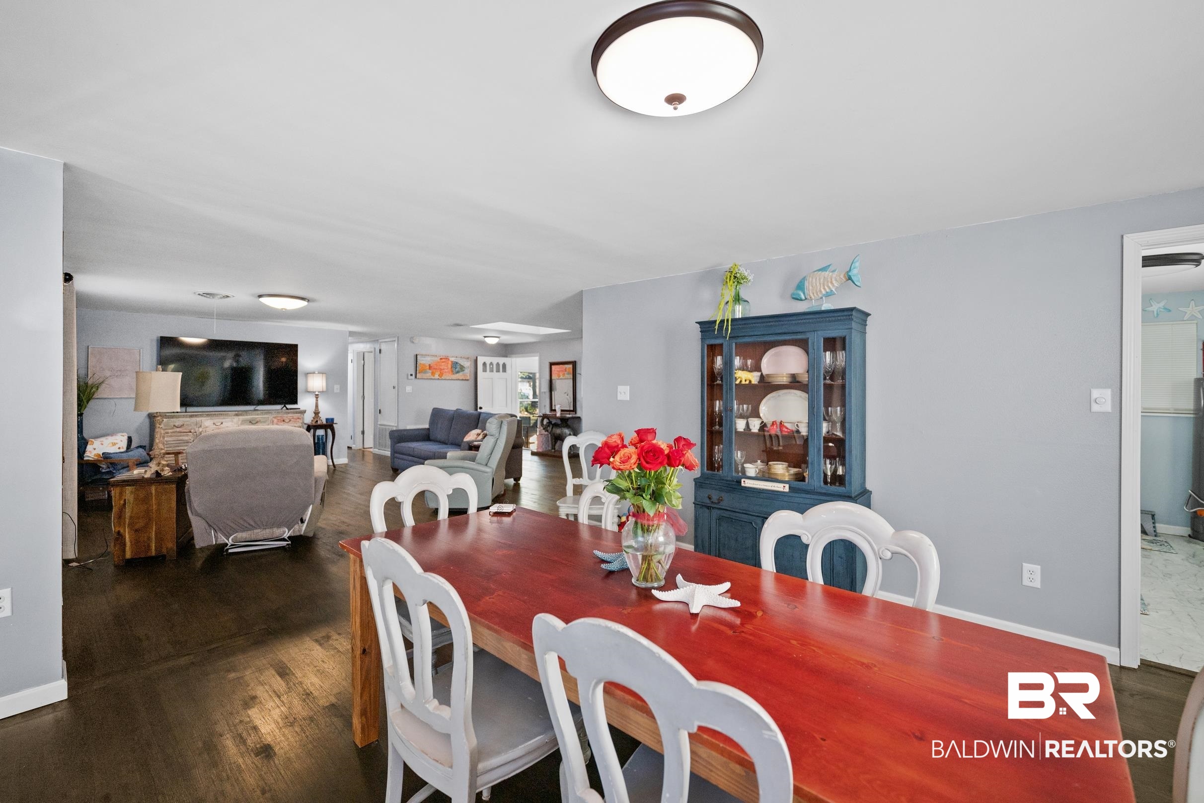 401 West Myrtle Avenue Foley, AL 36535 - Photo 10 of 39 Dining area featuring dark wood-style flooring and baseboards