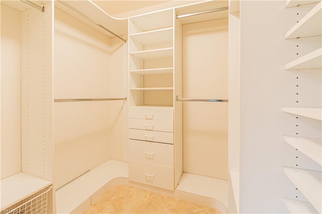 519 Cormorant Cove Naples, FL 34113 - Photo 11 of 32 a bathroom with a shower