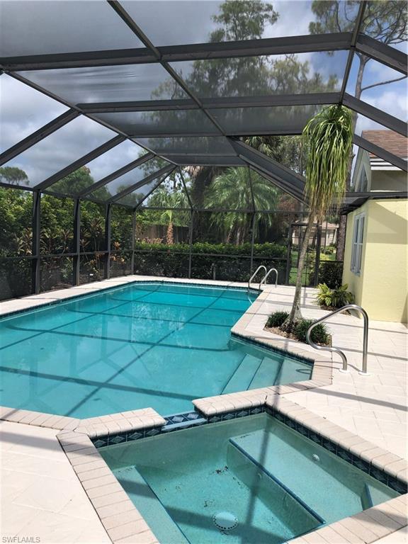 519 Cormorant Cove Naples, FL 34113 - Photo 2 of 32 a view of a chairs and table in patio