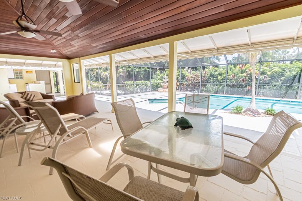 519 Cormorant Cove Naples, FL 34113 - Photo 23 of 32 a dining room with furniture water view and balcony view