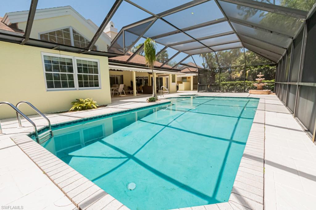 519 Cormorant Cove Naples, FL 34113 - Photo 27 of 32 a house view with a seating space