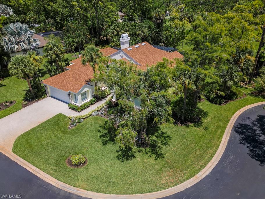 519 Cormorant Cove Naples, FL 34113 - Photo 29 of 32 an aerial view of a house