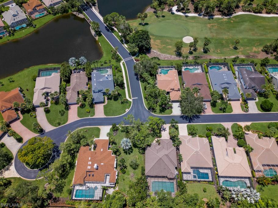 519 Cormorant Cove Naples, FL 34113 - Photo 32 of 32 an aerial view of houses with outdoor space