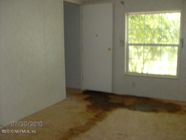 4129 Pinto Road Middleburg, FL 32068 - Photo 7 of 10 a view of an empty room with a window