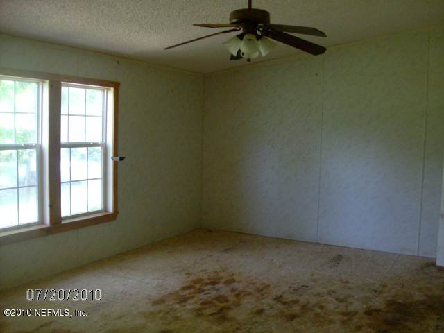 4129 Pinto Road Middleburg, FL 32068 - Photo 9 of 10 an empty room with a window