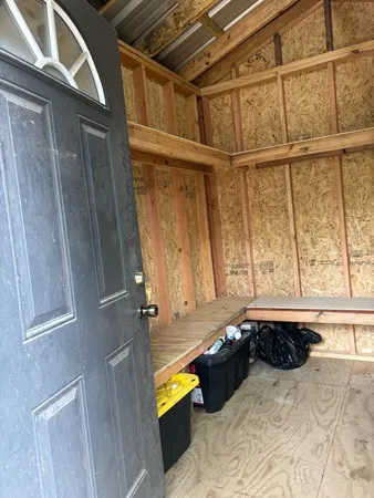 a bathroom with a tub and a window