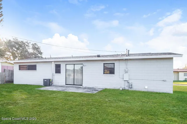 a view of a backyard with a garden and plants