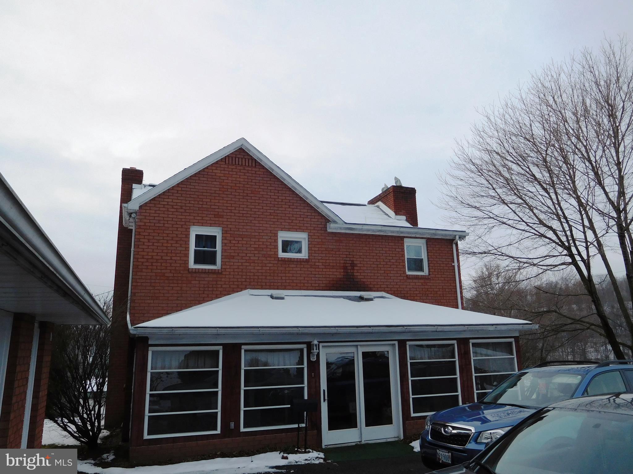 14920 Cemetery Road Midland, MD 21532 - Photo 23 of 26 a front view of a house with a porch