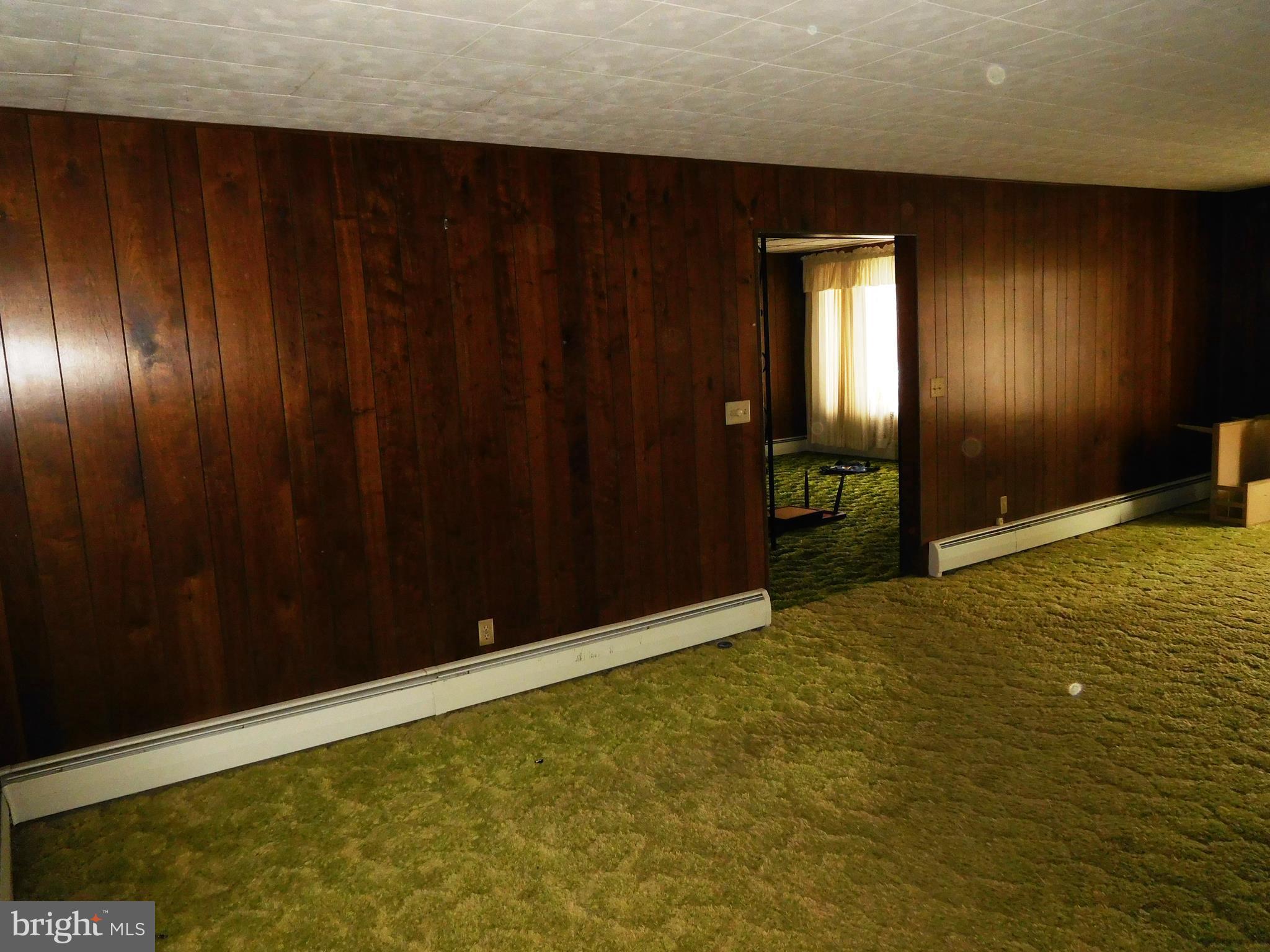 14920 Cemetery Road Midland, MD 21532 - Photo 3 of 26 a view of an empty room with wooden floor